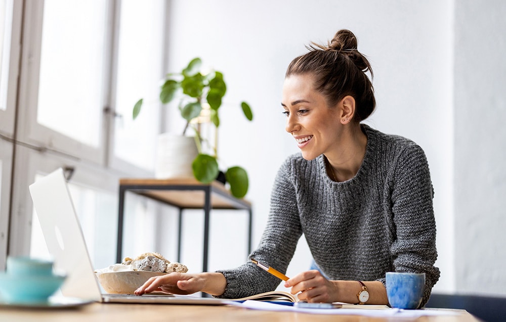 woman happy on the computer